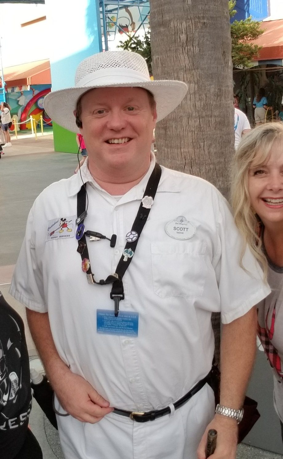 Disney cast member with mystery trading pin